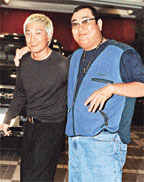 卢惠光(左)与段伟伦